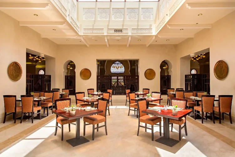 The dining area of the Al Majlis restaurant at Miramar Al Aqah Beach Resort