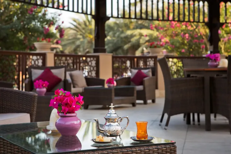 The seating area of Al Moltaqa restaurant at Miramar Al Aqah Beach Resort